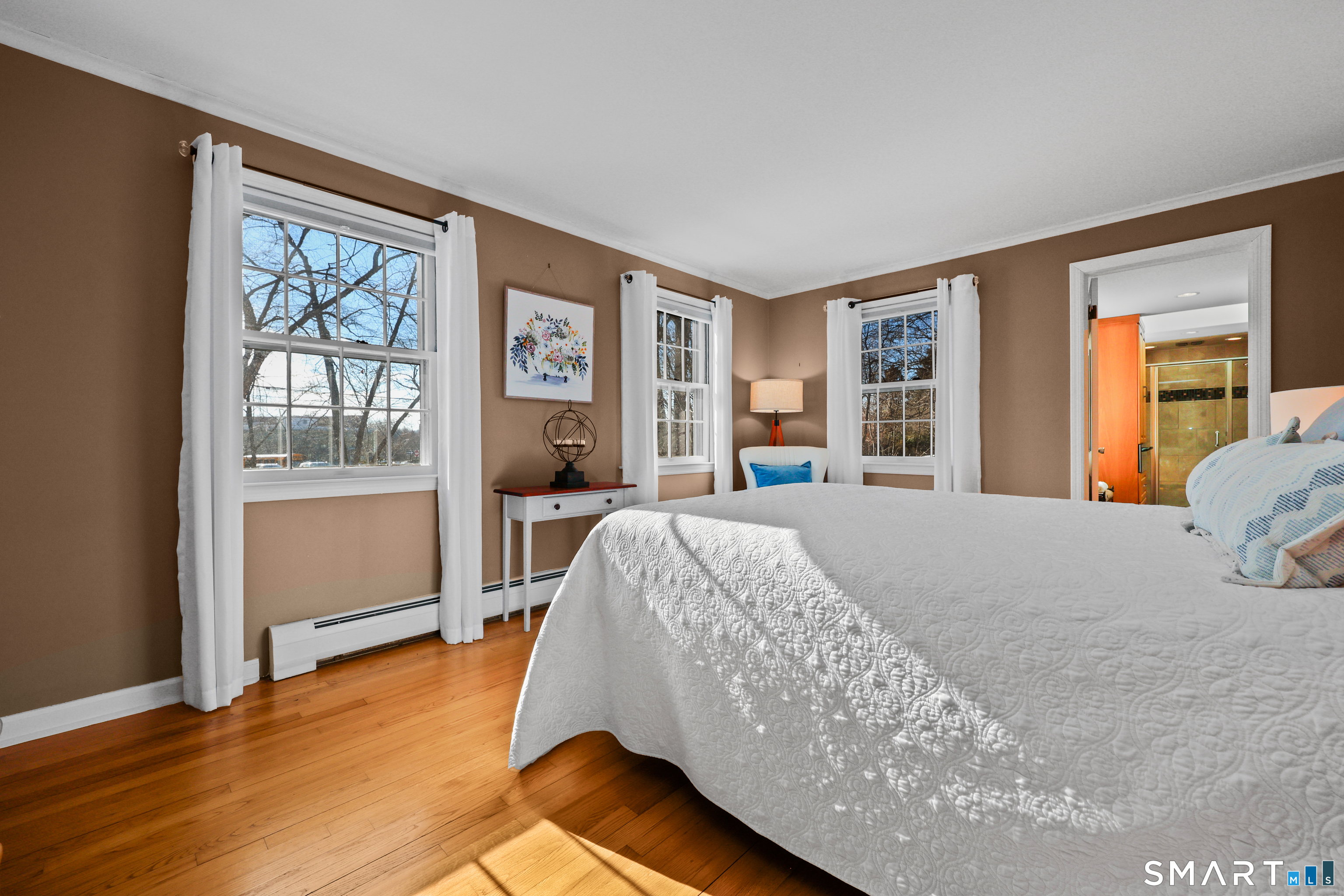 610 Unquowa Road Fairfield, CT 06824 - Photo 32 of 43 a bed sitting in a spacious bedroom next to a window