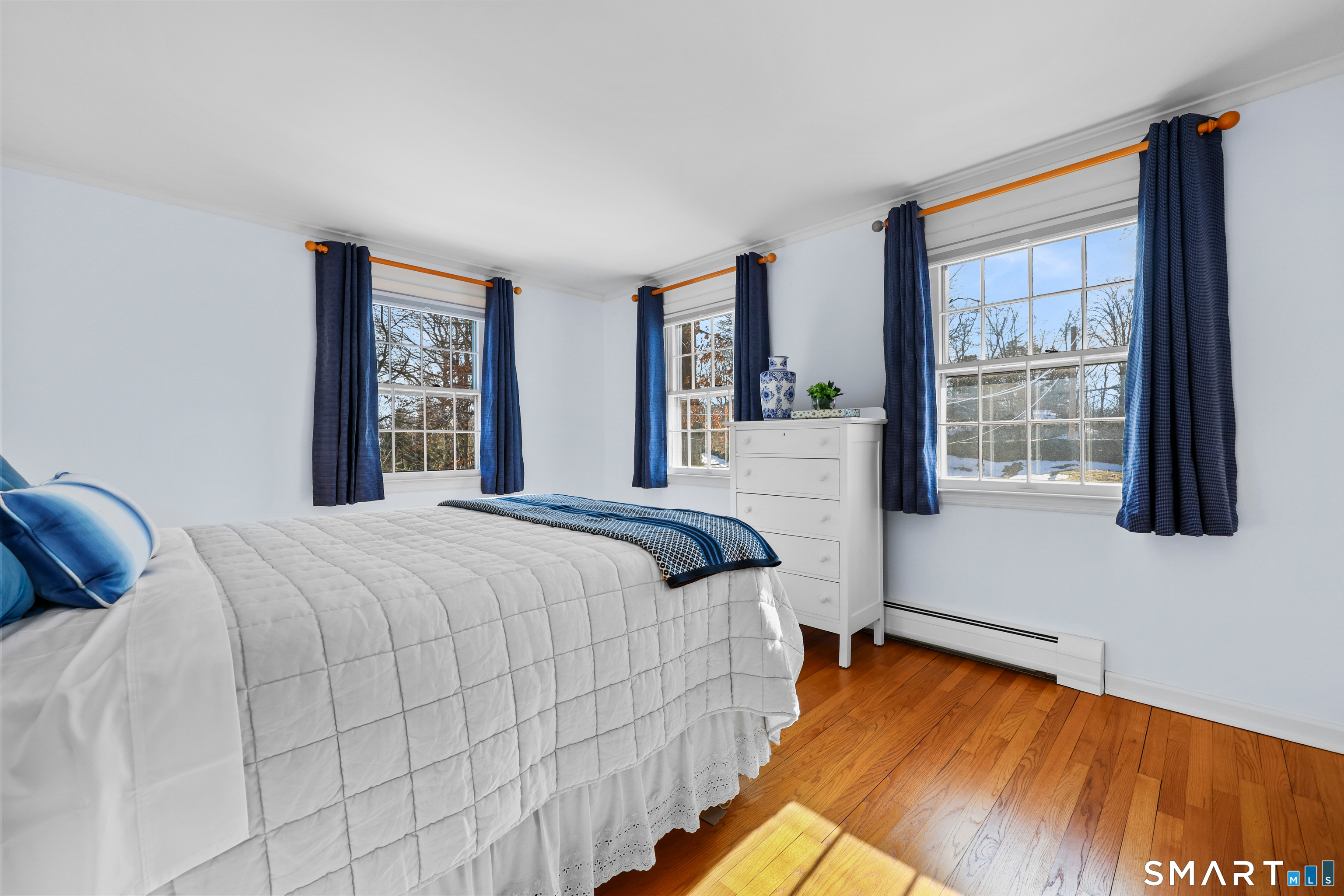 610 Unquowa Road Fairfield, CT 06824 - Photo 38 of 43 a bedroom with a bed and window