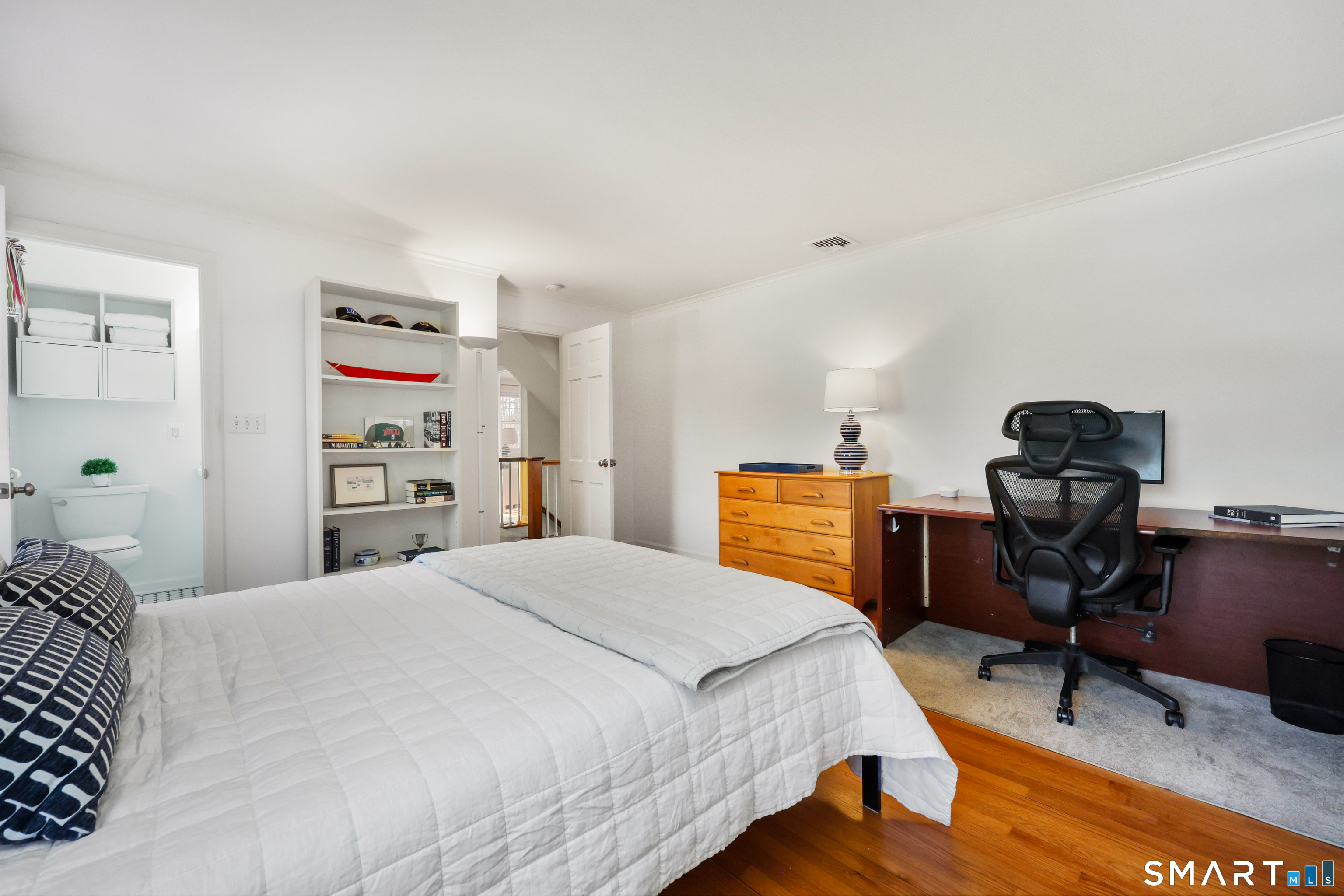 610 Unquowa Road Fairfield, CT 06824 - Photo 42 of 43 a bedroom with a bed and a desk