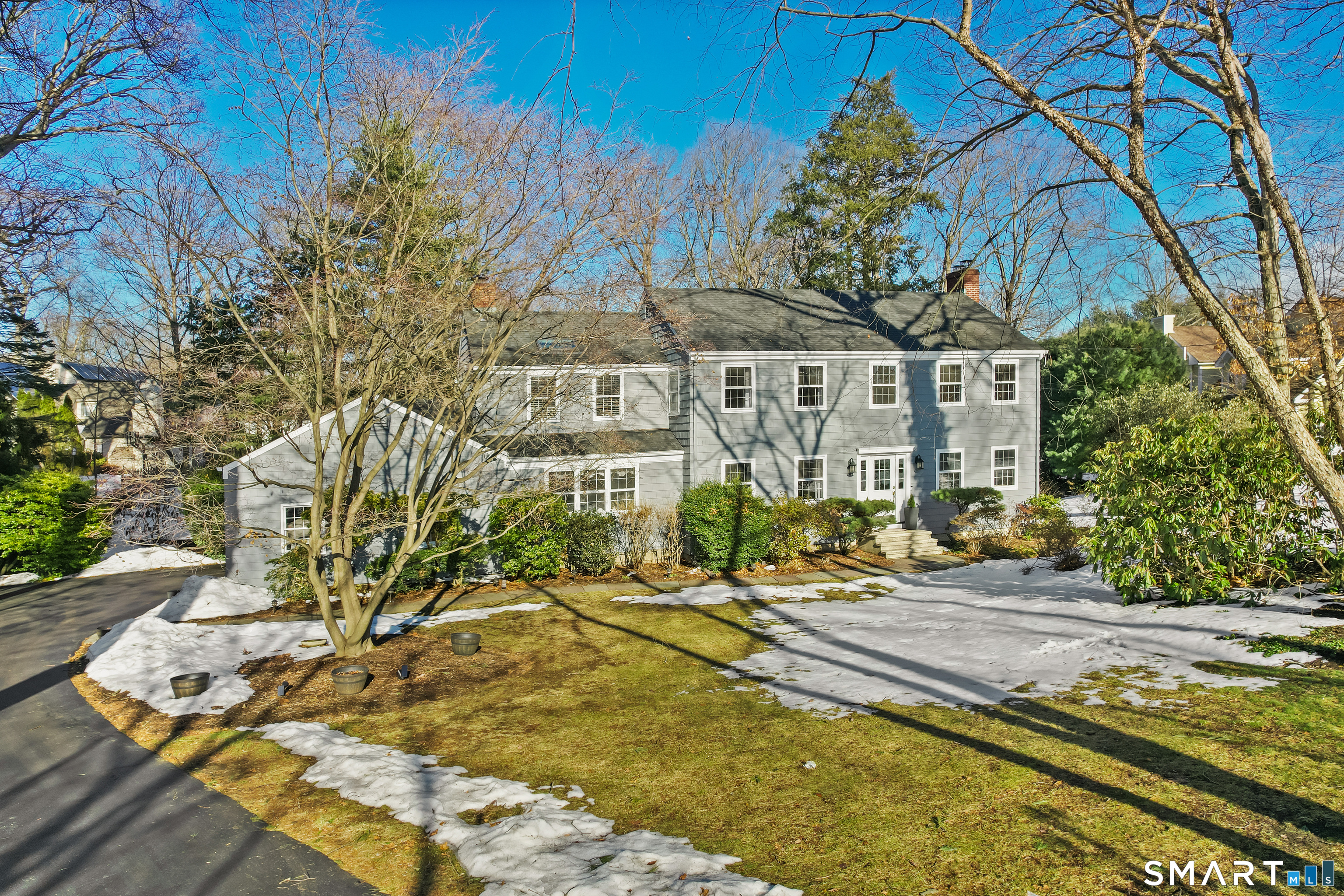 610 Unquowa Road Fairfield, CT 06824 - Photo 8 of 43 a building with trees in front of it