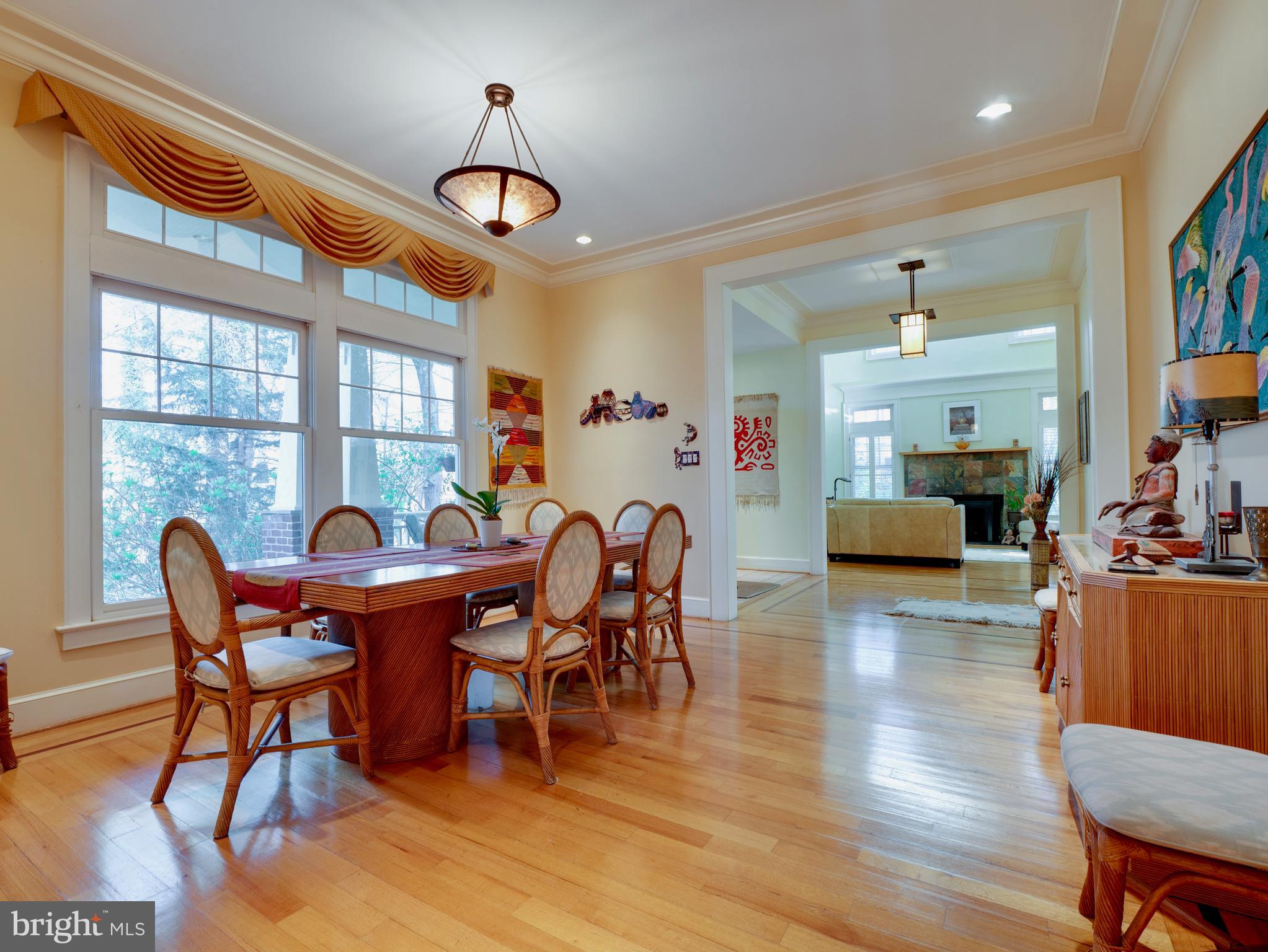 6306 Valley Road Bethesda, MD 20817 - Photo 26 of 74 a dining room with furniture a chandelier and wooden floor