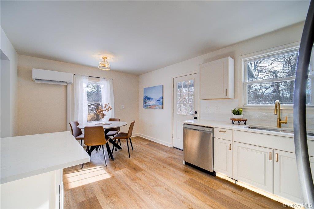 392 Titusville Road Poughkeepsie, NY 12603 - Photo 18 of 43 a view of a dining room with furniture and wooden floor