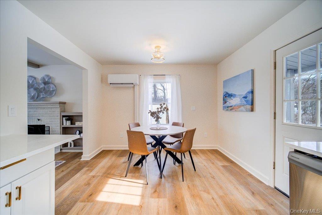 392 Titusville Road Poughkeepsie, NY 12603 - Photo 19 of 43 a view of a dining room with furniture and wooden floor