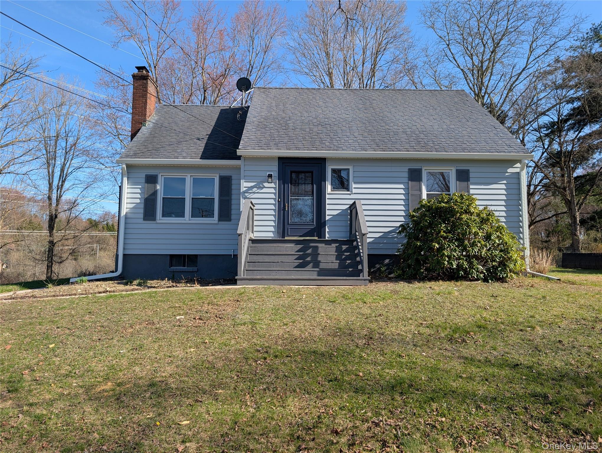 392 Titusville Road Poughkeepsie, NY 12603 - Photo 2 of 43 a house that has a tree in front of it
