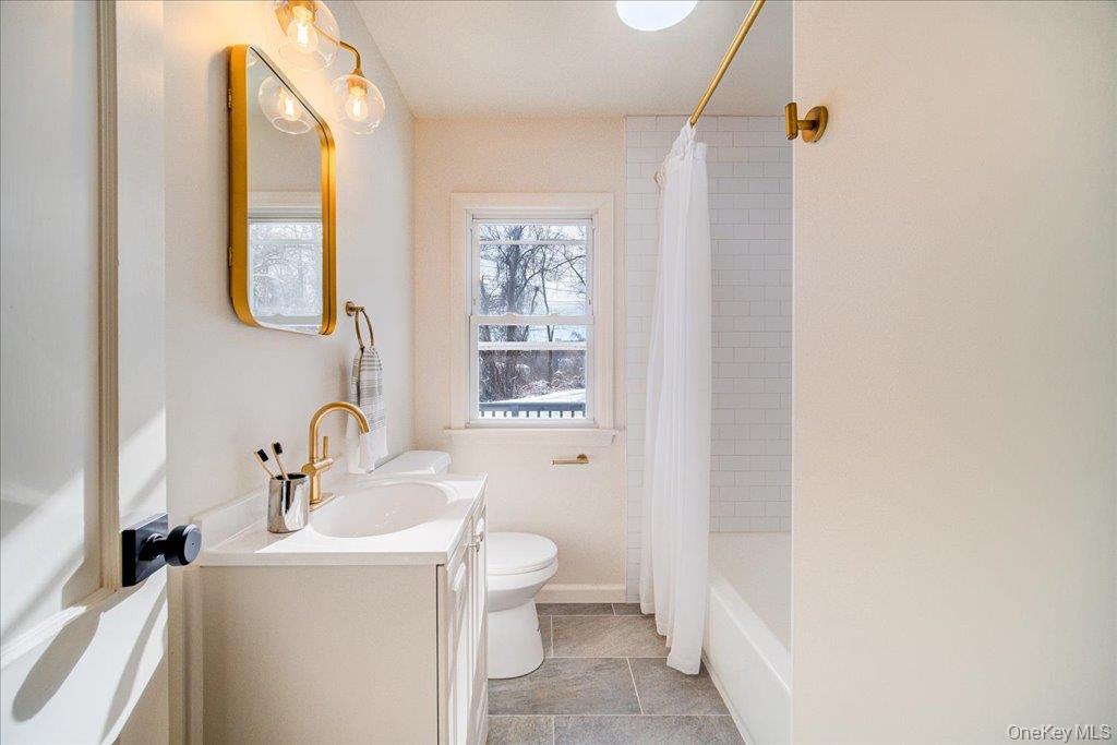 392 Titusville Road Poughkeepsie, NY 12603 - Photo 21 of 43 a bathroom with a toilet sink and mirror