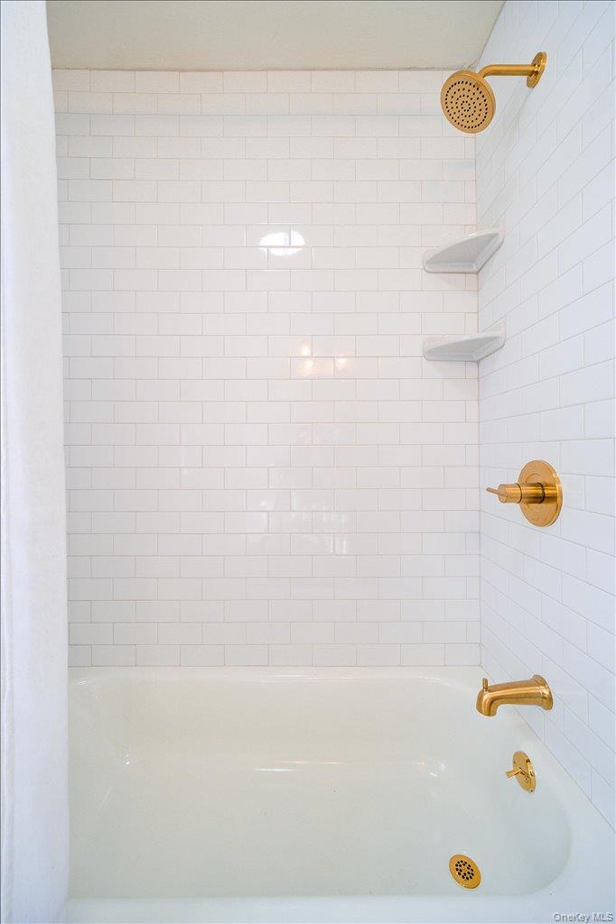 392 Titusville Road Poughkeepsie, NY 12603 - Photo 22 of 43 a bathroom with a bath tub