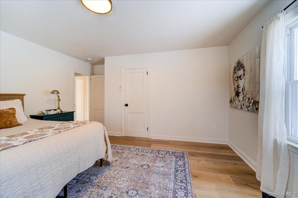 392 Titusville Road Poughkeepsie, NY 12603 - Photo 25 of 43 a bedroom with a bed and a window