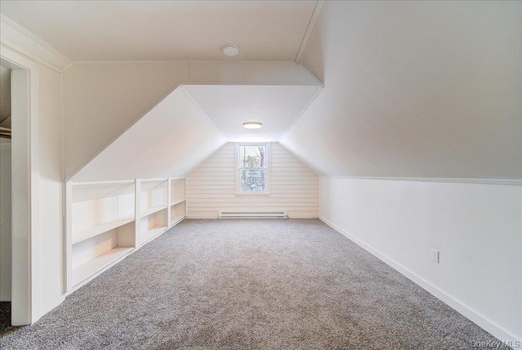 392 Titusville Road Poughkeepsie, NY 12603 - Photo 29 of 43 an empty room with windows and pillars in it
