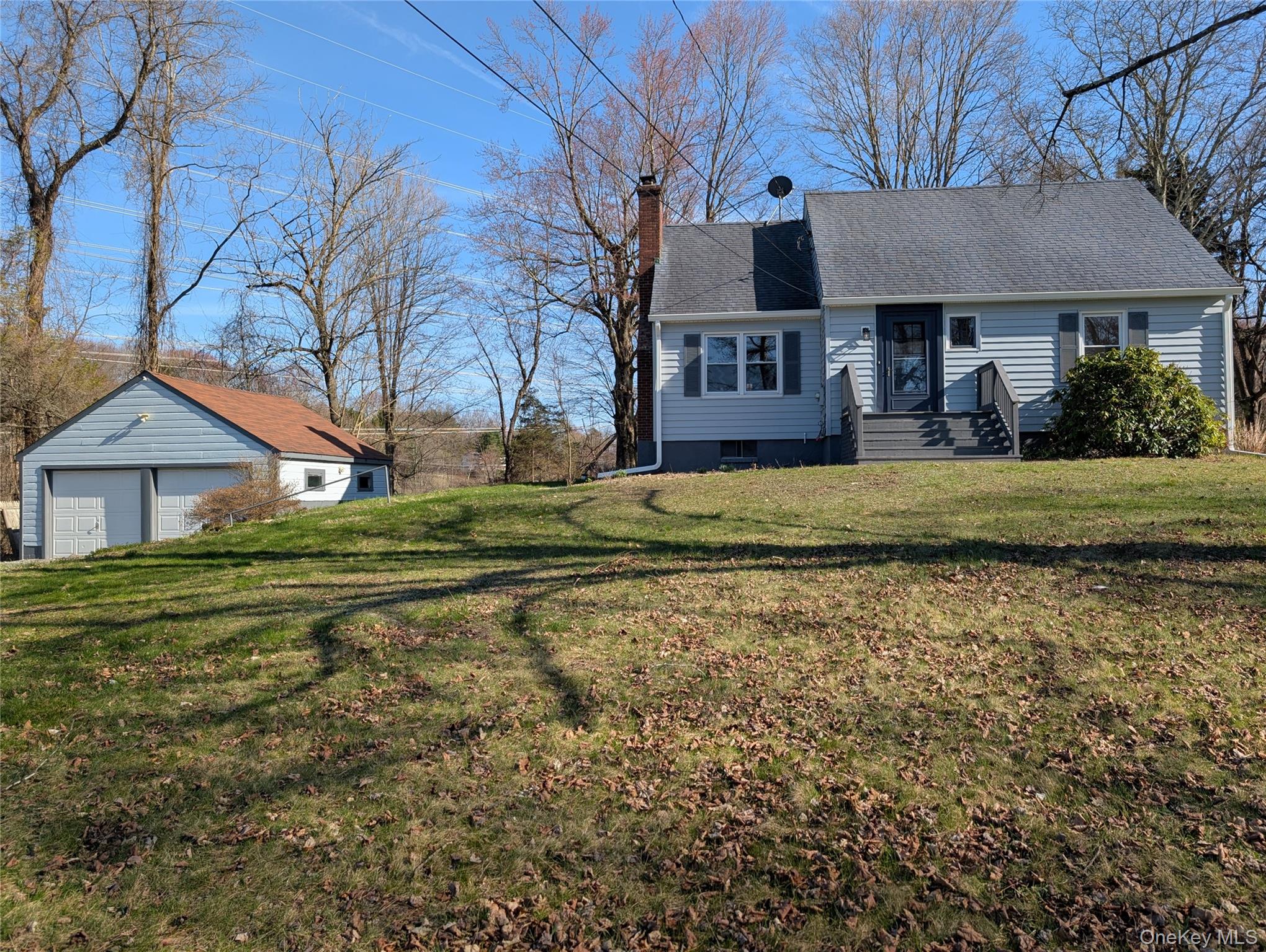392 Titusville Road Poughkeepsie, NY 12603 - Photo 43 of 43 a front view of a house with a garden