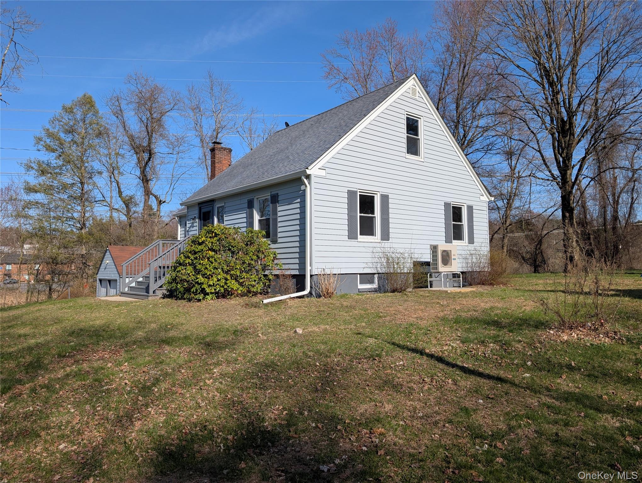 392 Titusville Road Poughkeepsie, NY 12603 - Photo 7 of 43 a view of a yard in front of a house with large trees