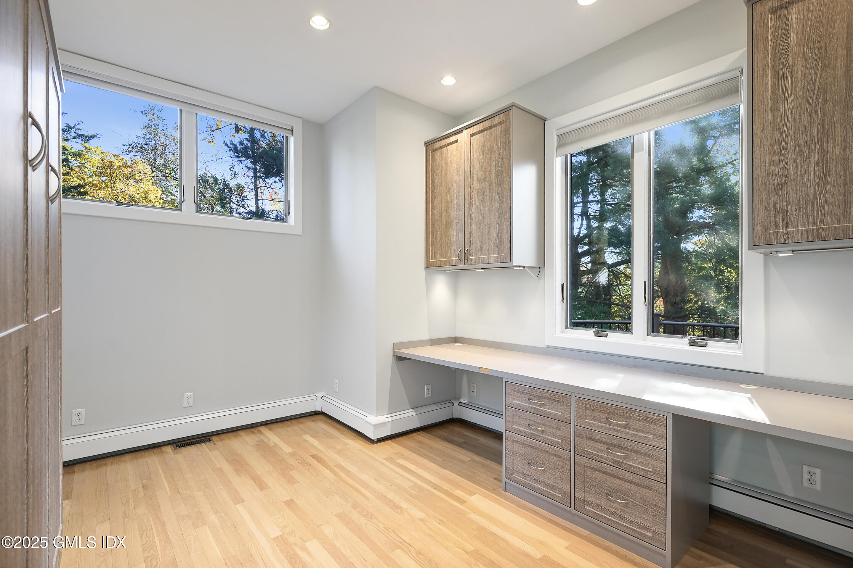 249 Shore Road Greenwich, CT 06830 - Photo 11 of 38 a view of a kitchen with wooden floor and outdoor space