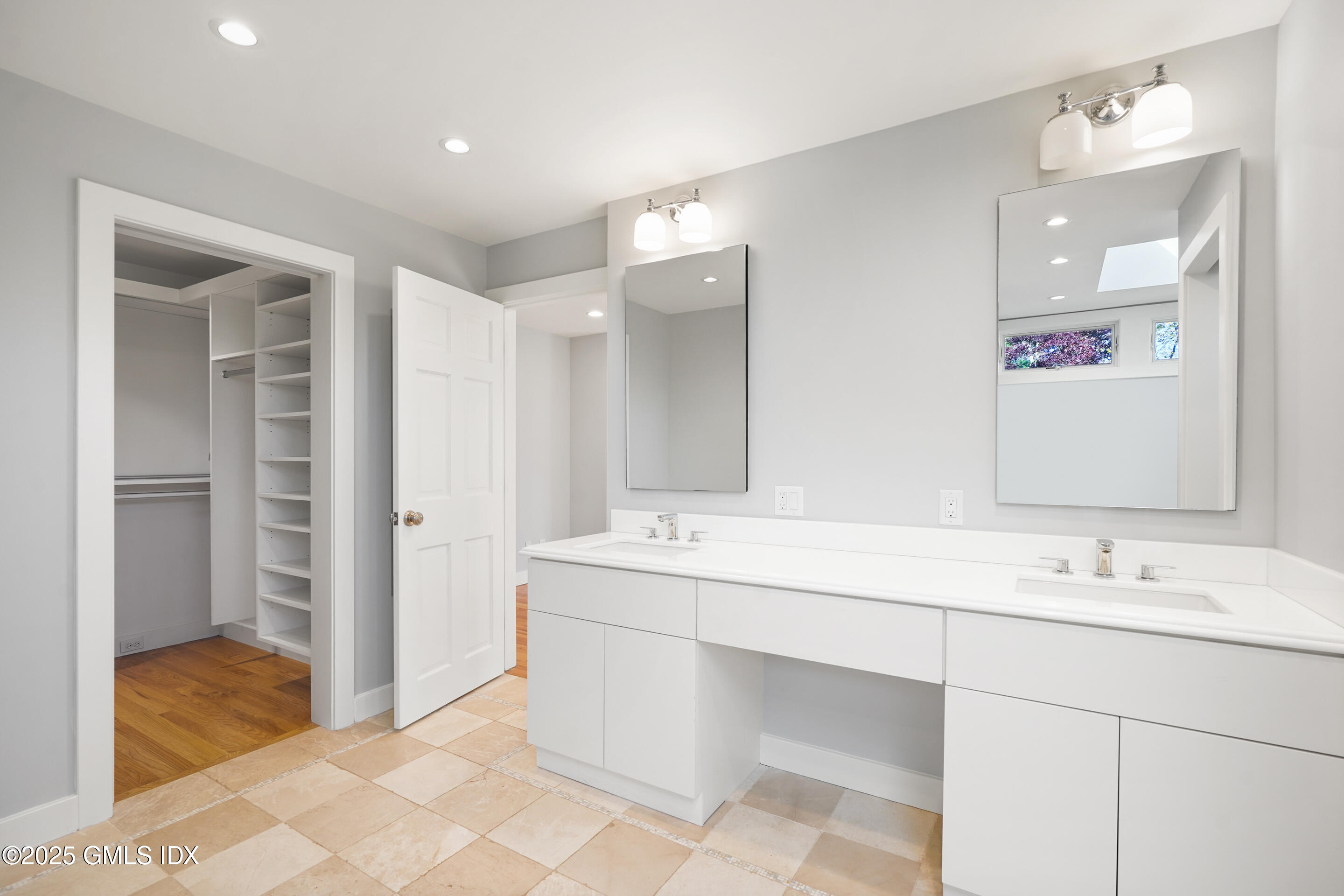 249 Shore Road Greenwich, CT 06830 - Photo 19 of 38 a bathroom with a sink tub and a mirror