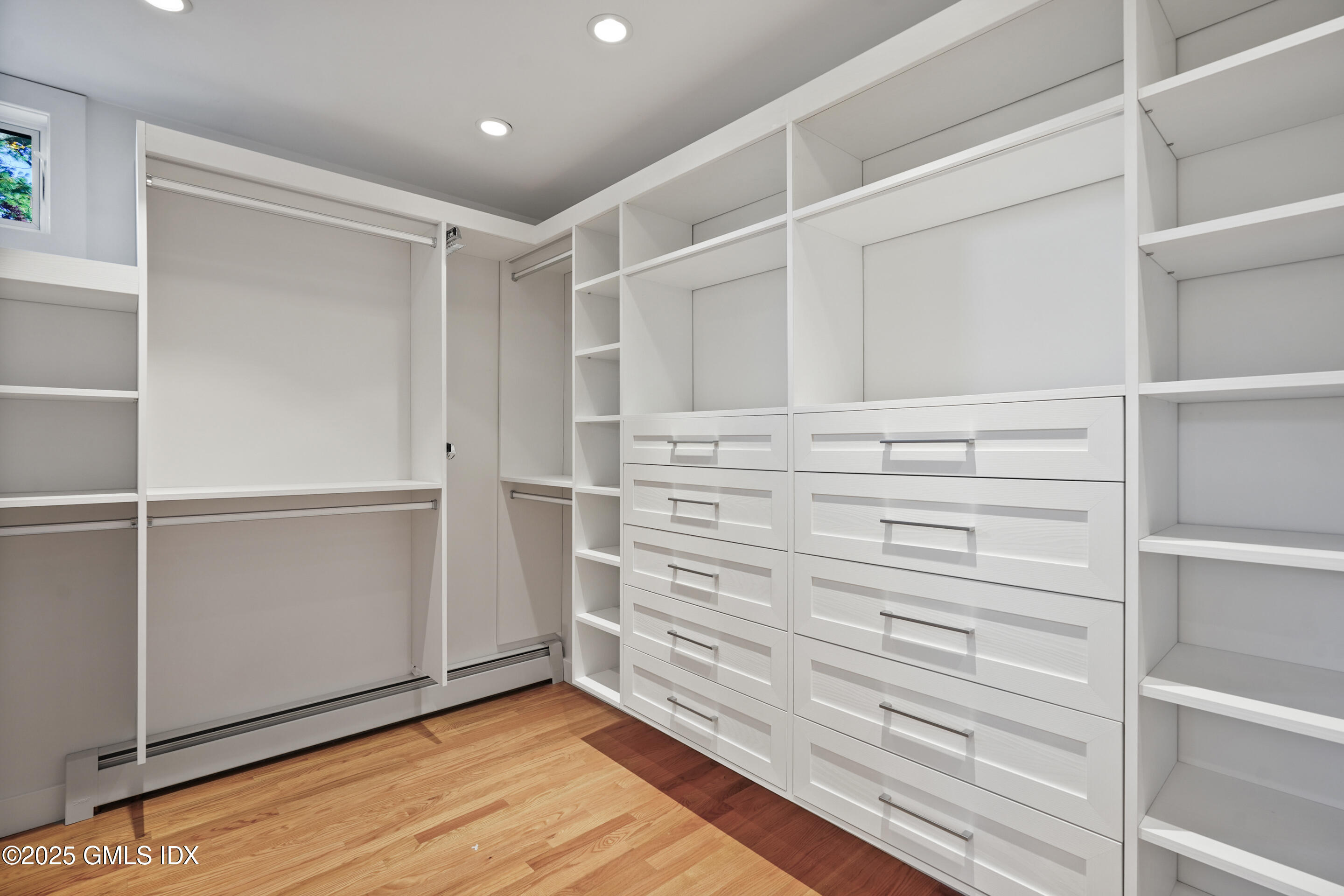 249 Shore Road Greenwich, CT 06830 - Photo 21 of 38 a view of walk in closet with empty racks