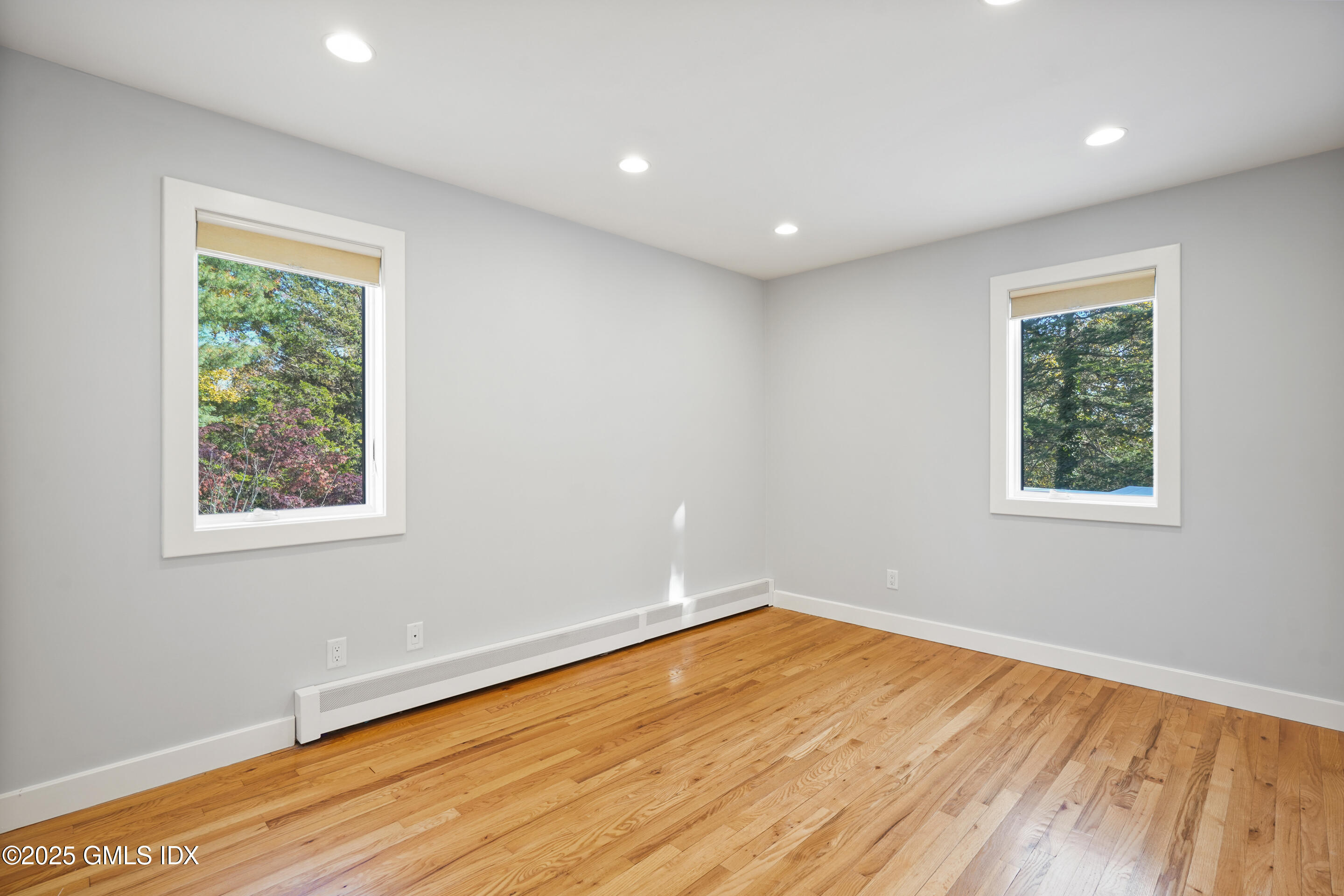249 Shore Road Greenwich, CT 06830 - Photo 25 of 38 a view of empty room with wooden floor and fan