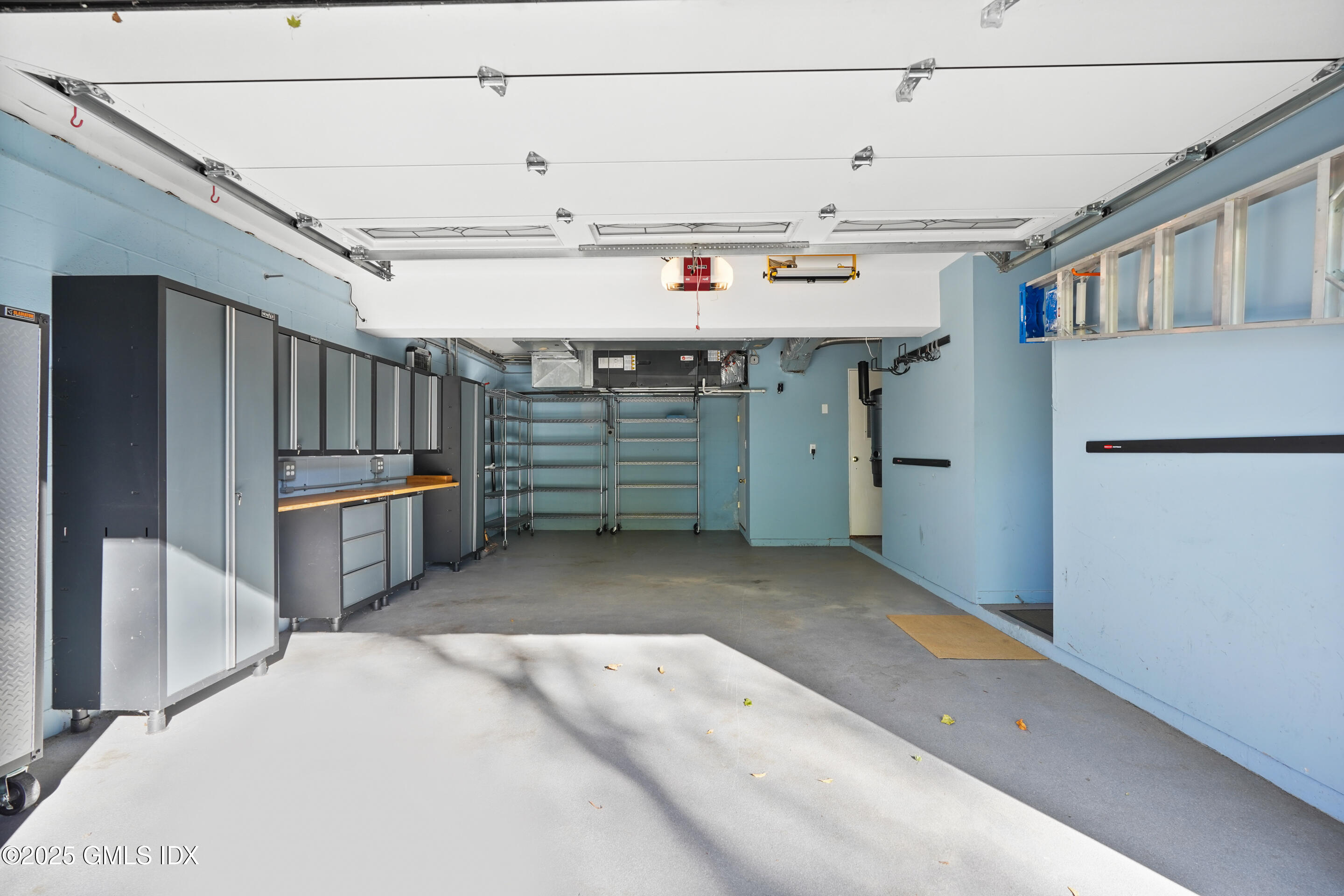 249 Shore Road Greenwich, CT 06830 - Photo 32 of 38 a view of a kitchen with refrigerator and windows