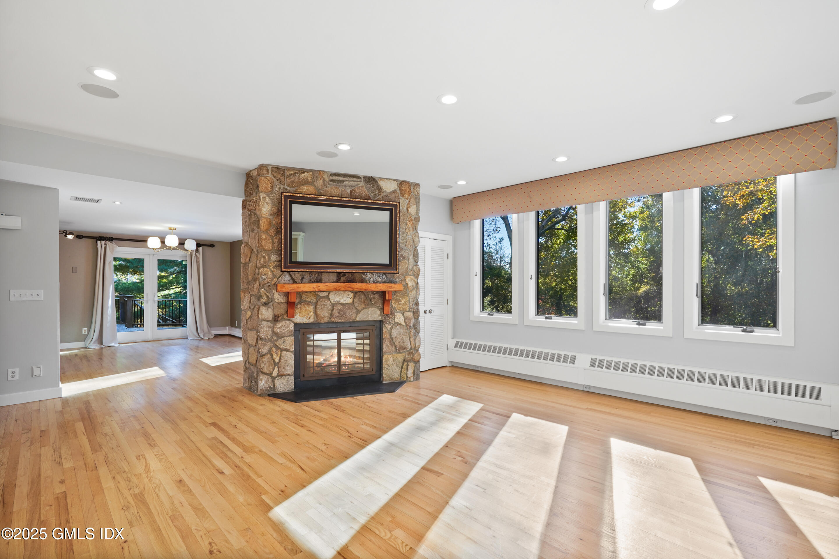 249 Shore Road Greenwich, CT 06830 - Photo 8 of 38 a spacious bedroom with a large bed and a large window