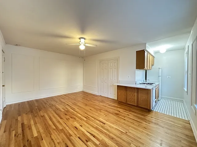 a view of a kitchen with a sink and a kitchen area