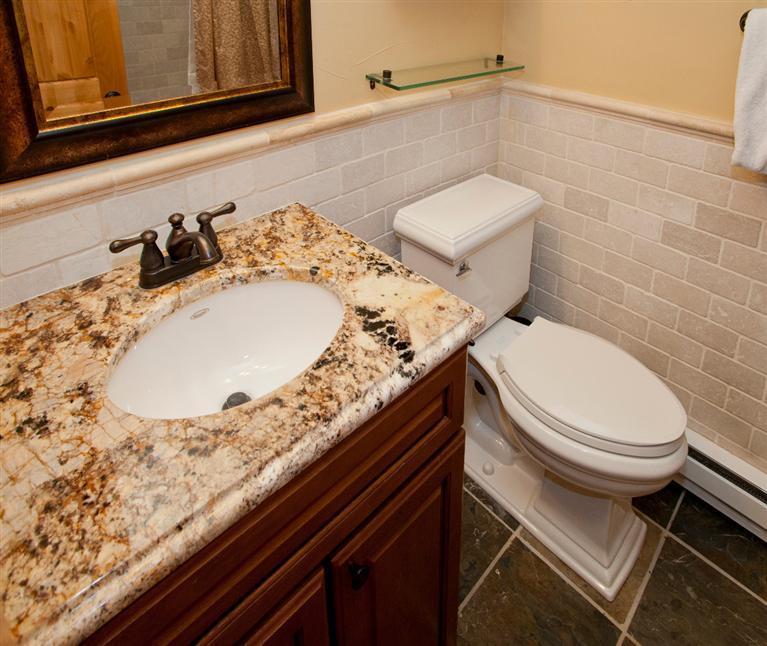 4192 Spruce Way, Unit 204A Vail, CO 81657 - Photo 12 of 21 a bathroom with a granite countertop sink and a toilet