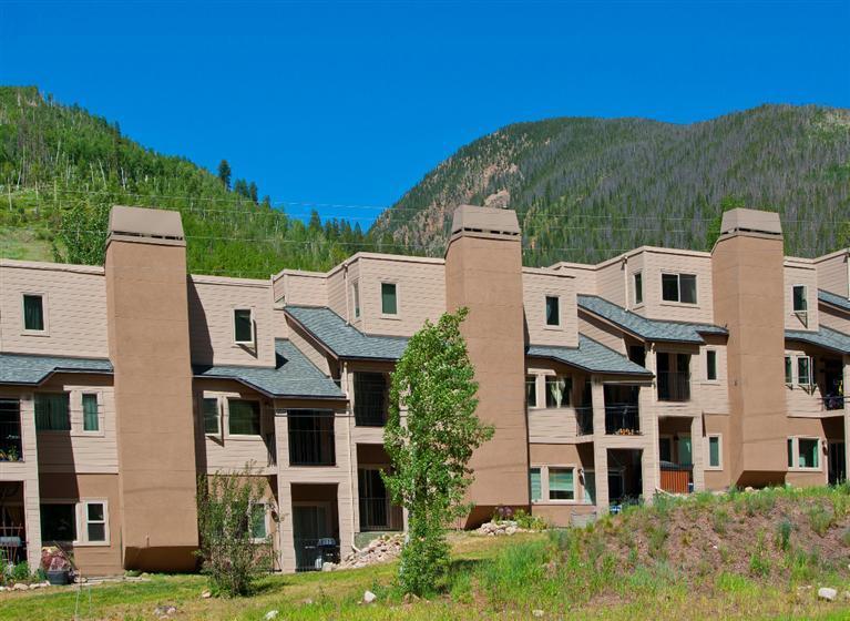 4192 Spruce Way, Unit 204A Vail, CO 81657 - Photo 16 of 21 a aerial view of a brick house next to a yard
