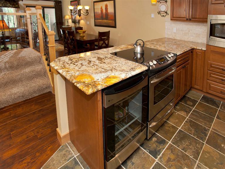 4192 Spruce Way, Unit 204A Vail, CO 81657 - Photo 21 of 21 a kitchen with a sink stove and cabinets