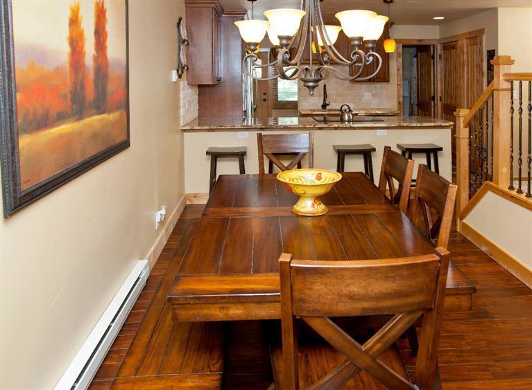 4192 Spruce Way, Unit 204A Vail, CO 81657 - Photo 3 of 21 a dining room with furniture and wooden floor
