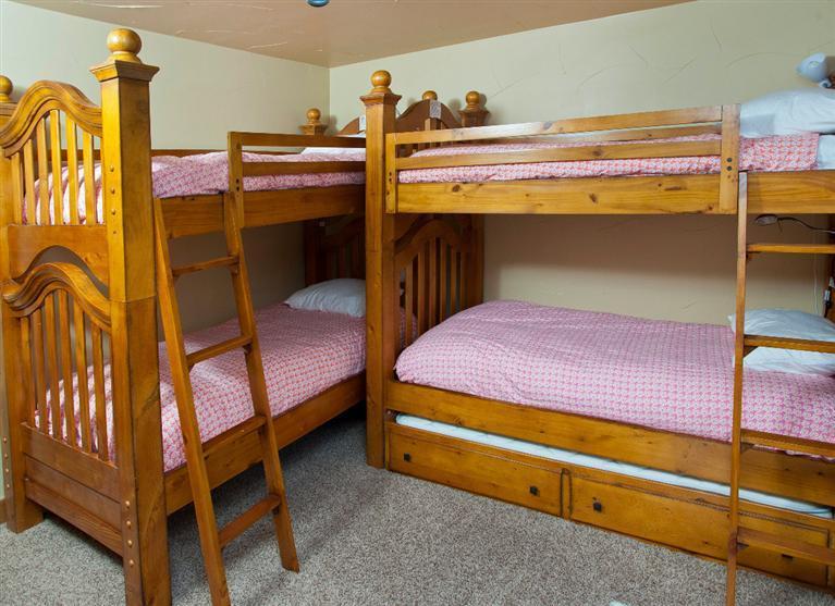 4192 Spruce Way, Unit 204A Vail, CO 81657 - Photo 7 of 21 a bedroom with a bunk bed and a dresser