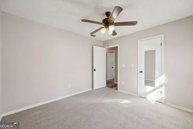 a bathroom with a sink a mirror and a vanity