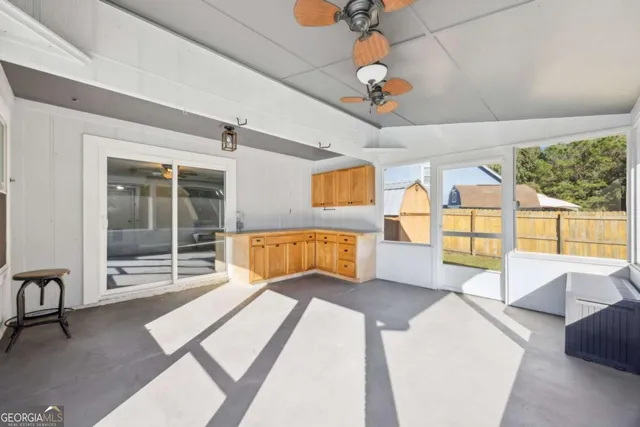 a spacious bathroom with a tub and mirror