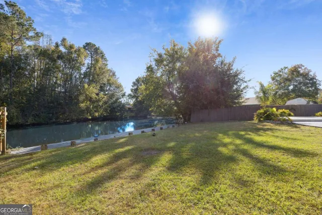 a view of a lake from a yard