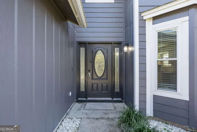 a front view of a house with garden