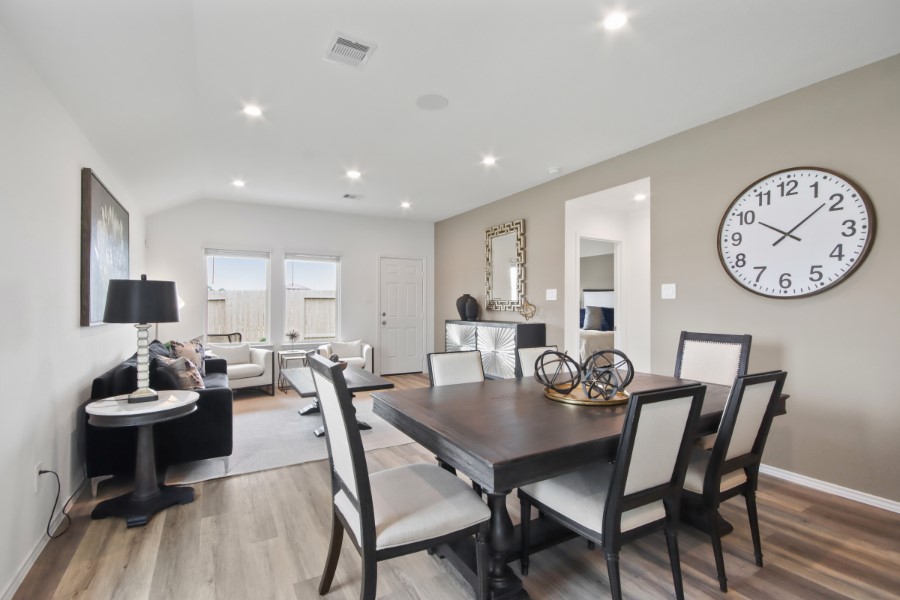 16903 Vinters Way Houston, TX 77090 - Photo 12 of 29 a view of a dining room with furniture and wooden floor