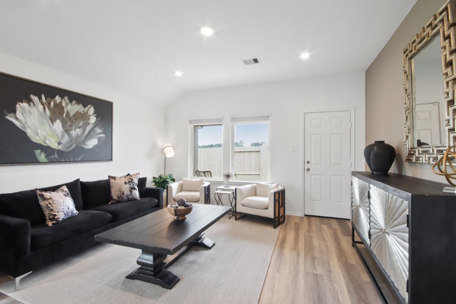 16903 Vinters Way Houston, TX 77090 - Photo 14 of 29 a living room with furniture and a fireplace