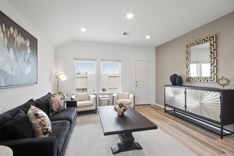 16903 Vinters Way Houston, TX 77090 - Photo 15 of 29 a living room with furniture a window and a lamp