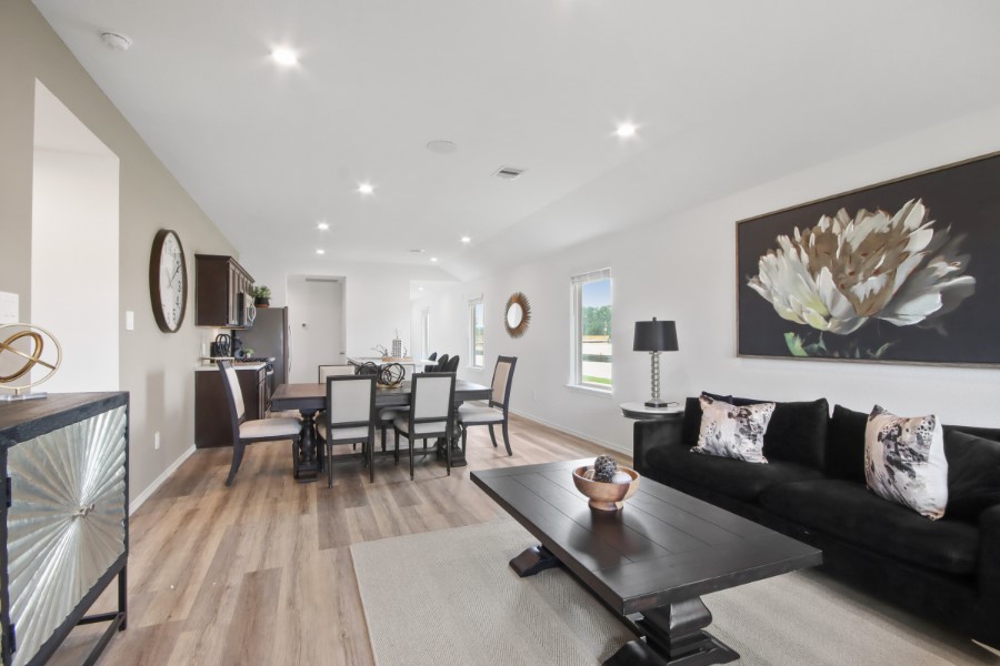 16903 Vinters Way Houston, TX 77090 - Photo 16 of 29 a living room with furniture and wooden floor