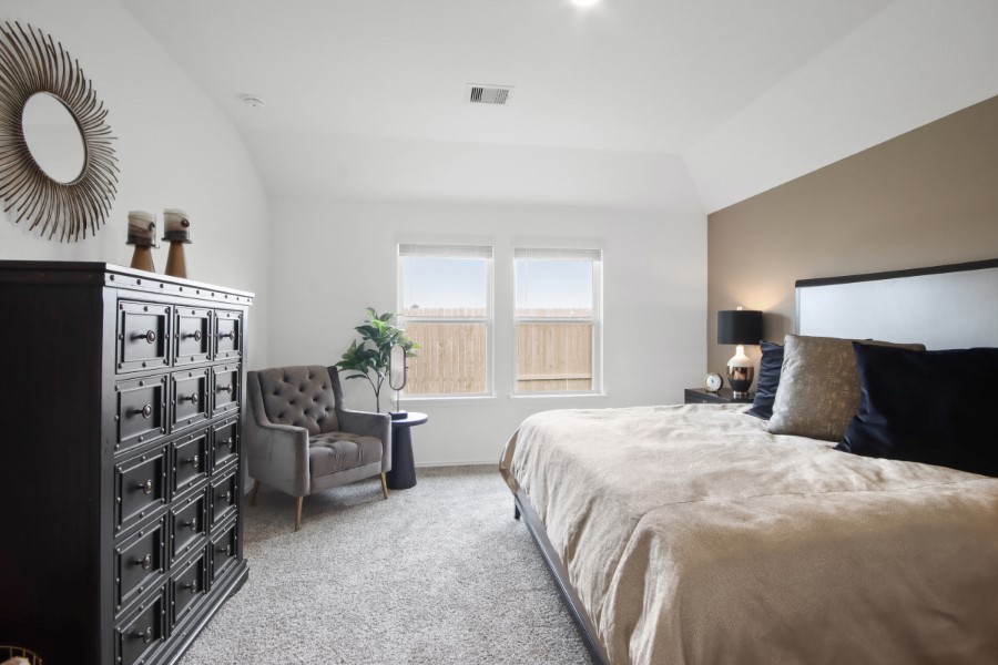 16903 Vinters Way Houston, TX 77090 - Photo 17 of 29 a bedroom with a bed and dresser