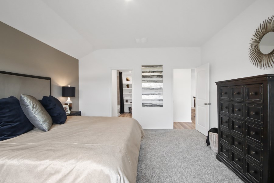 16903 Vinters Way Houston, TX 77090 - Photo 19 of 29 a bed room with a bed and a chair