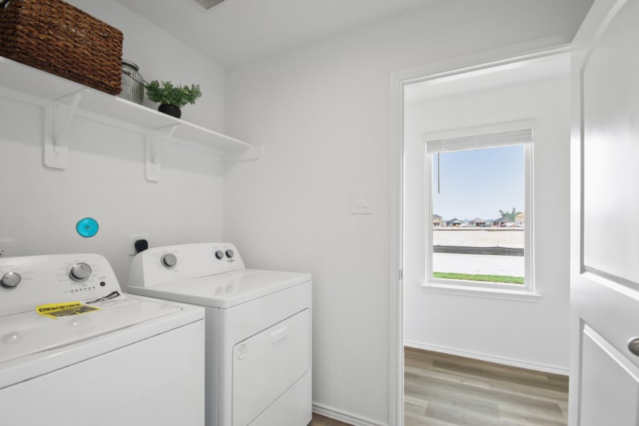 16903 Vinters Way Houston, TX 77090 - Photo 22 of 29 a view of utility room with washer and dryer
