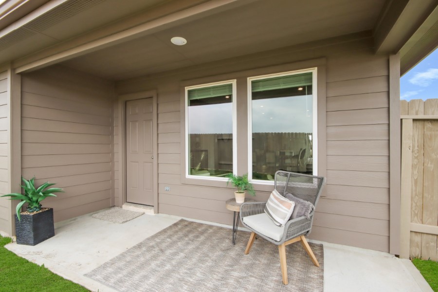 16903 Vinters Way Houston, TX 77090 - Photo 28 of 29 a building outdoor space with patio furniture and potted plants