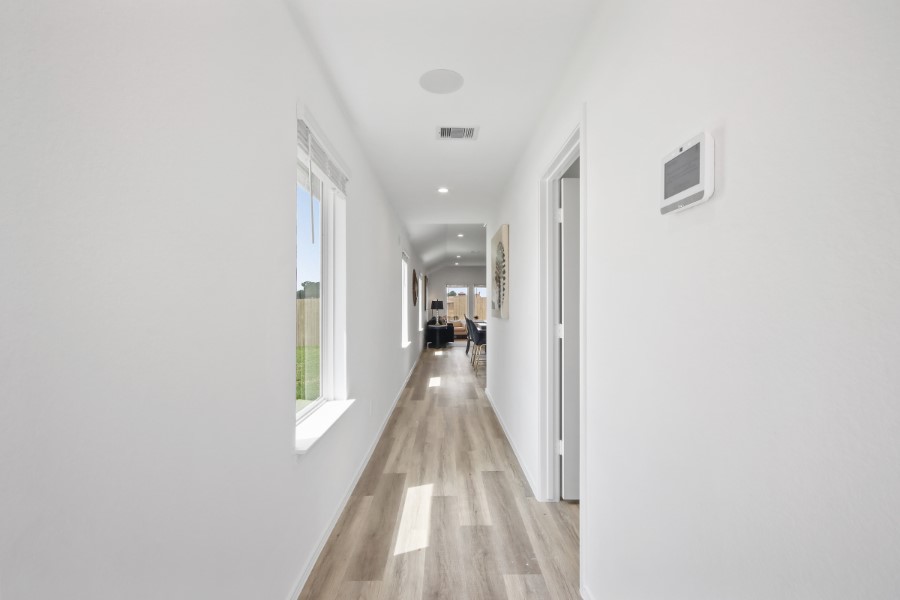 16903 Vinters Way Houston, TX 77090 - Photo 6 of 29 a view of a hallway with a white walls