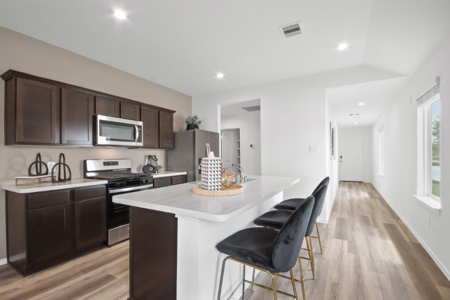 16903 Vinters Way Houston, TX 77090 - Photo 9 of 29 a kitchen with appliances cabinets and furniture