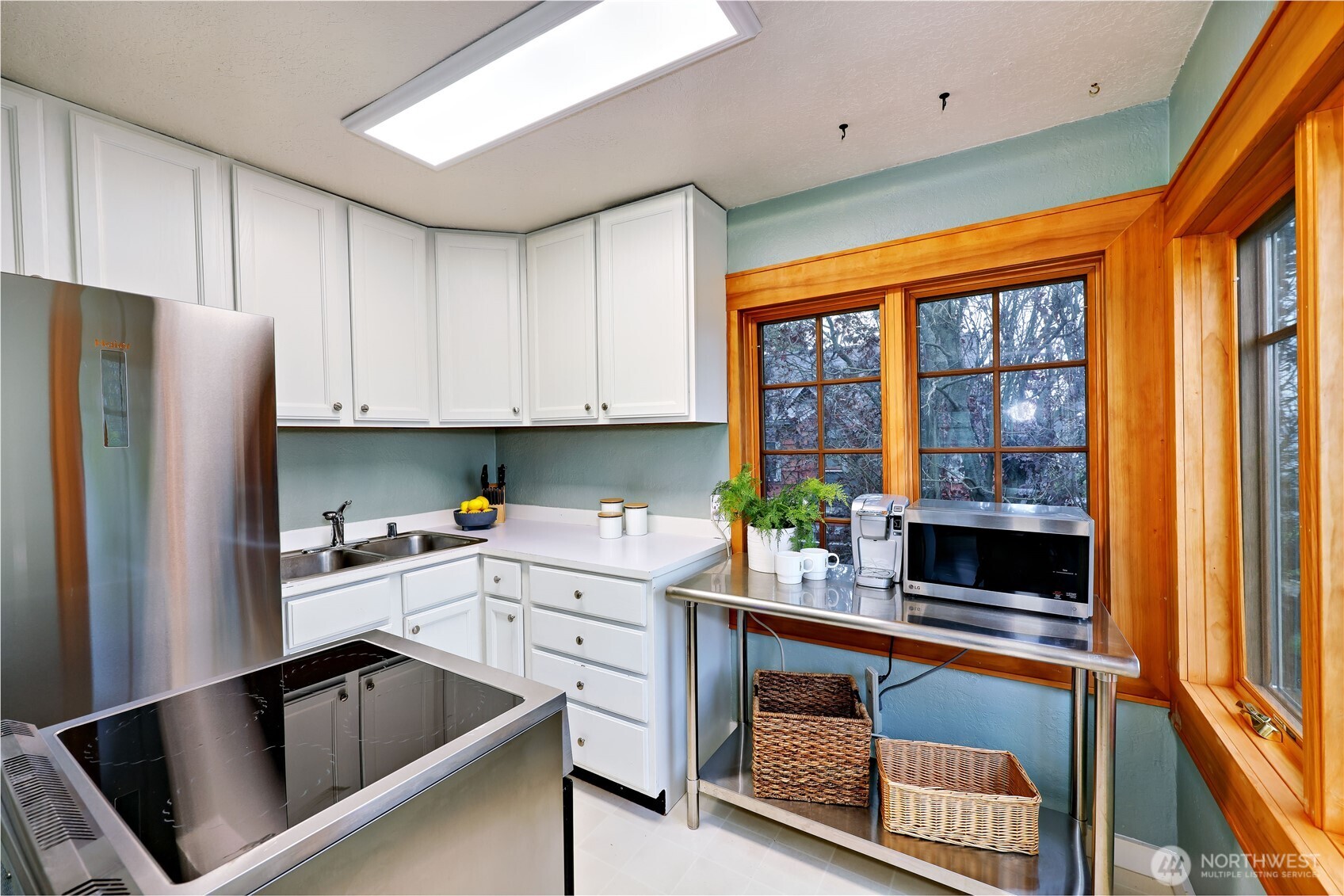717 Franklin Street Port Townsend, WA 98368 - Photo 16 of 40 a kitchen with granite countertop a refrigerator and a sink