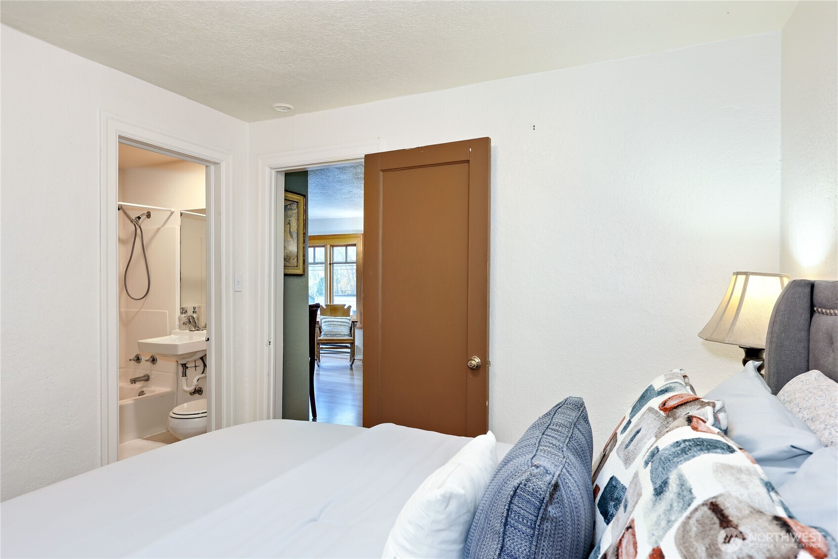 717 Franklin Street Port Townsend, WA 98368 - Photo 19 of 40 a bedroom with a bed and a mirror