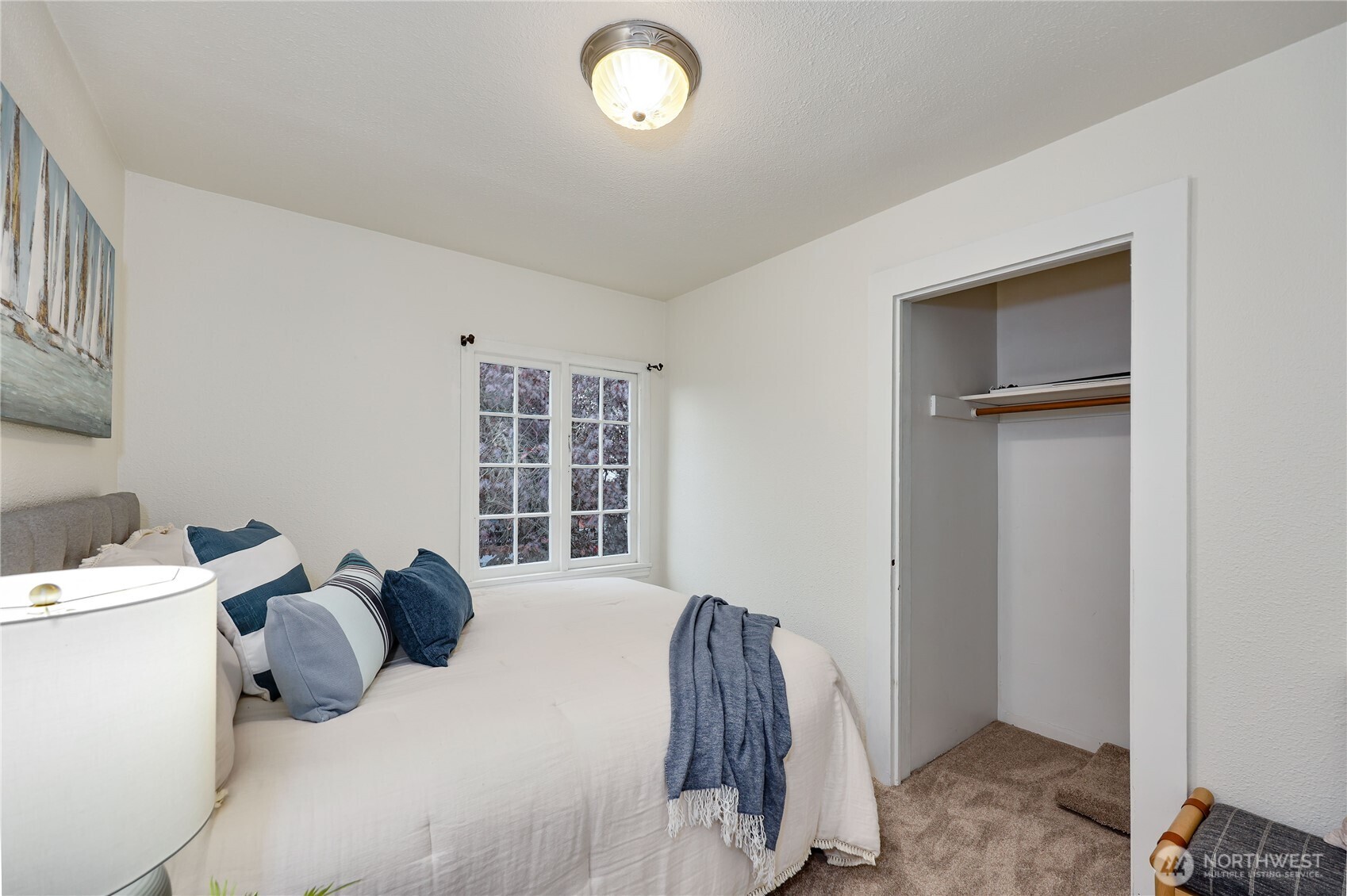 717 Franklin Street Port Townsend, WA 98368 - Photo 32 of 40 a bedroom with a bed and a window