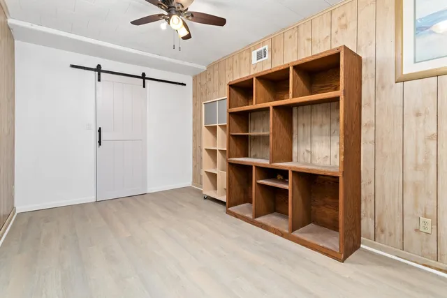 a view of a lake with houses in the background