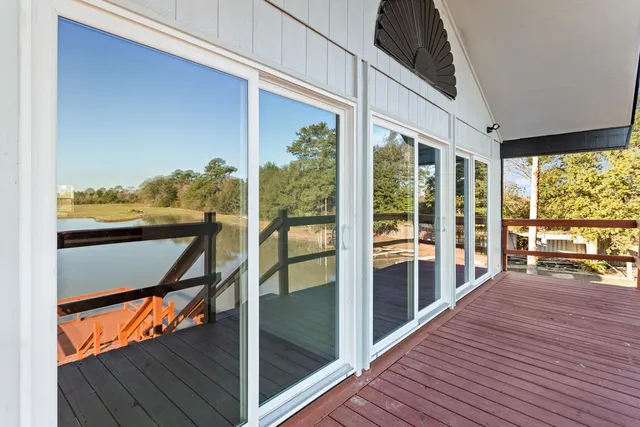 a wooden bench sitting next to a lake