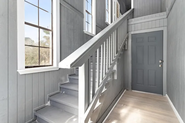 a kitchen with a sink vanity and a granite counter top