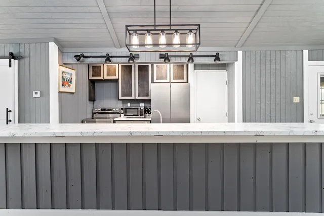 a kitchen with appliances and cabinets