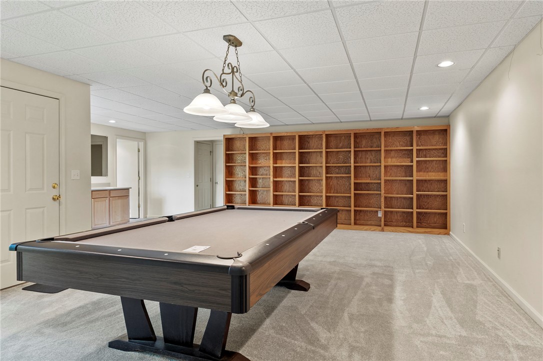 225 Arrowhead Trail Easley, SC 29642 - Photo 14 of 33 This versatile recreation room offers built-in shelving and ample space for entertainment.