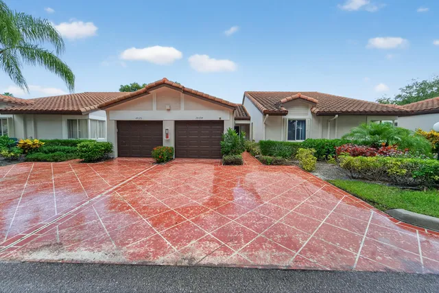 a lobby with furniture and a potted plant