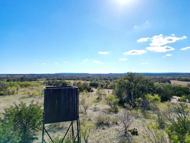 a view of a lake with a yard